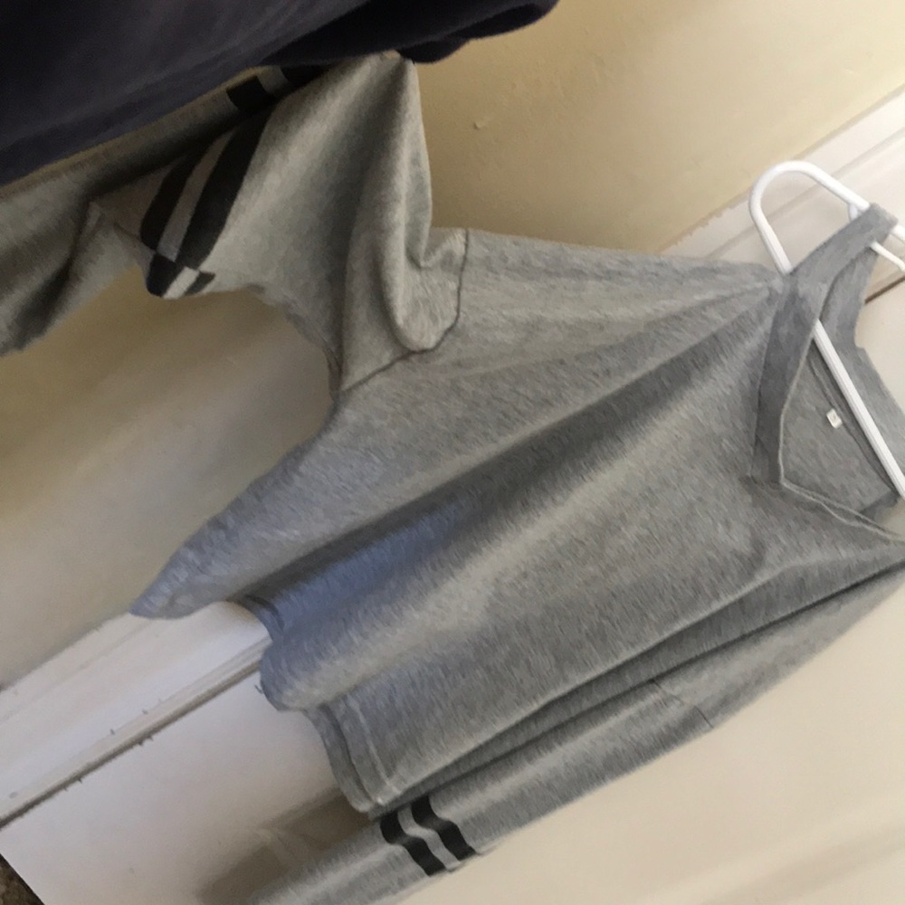 A gray crock top with black stripes